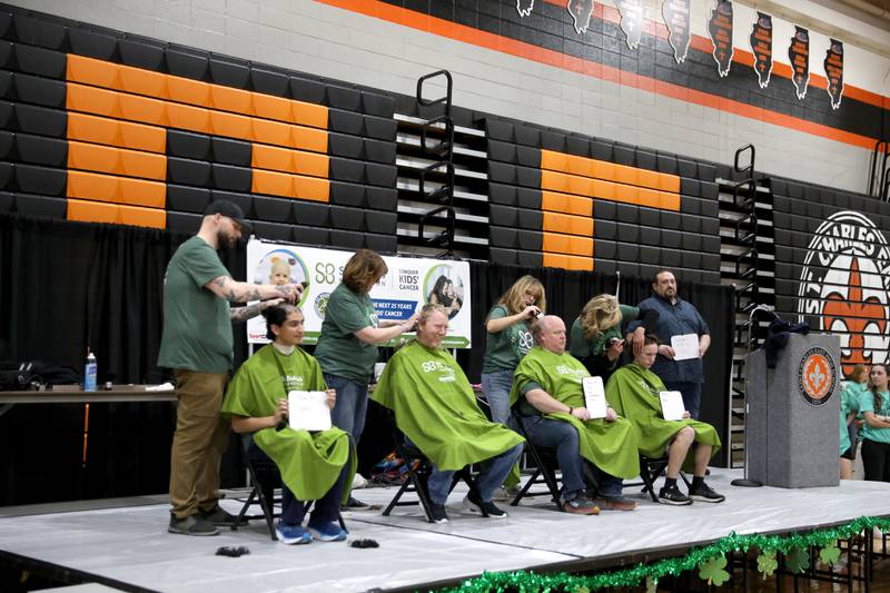 Participants have their heads shaved during the St. Charles Challenge fundraiser for the St. Baldrick’s Foundation on Friday, March 15, 2024 at St. Charles East High School.