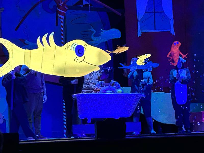 Oregon High School Senior Alease McLain performs a scene as Jojo while glow in the dark fish "swim" by during the school's presentation of "Seussical The Musical" on Friday, March 14, 2025 in the OHS Theater.