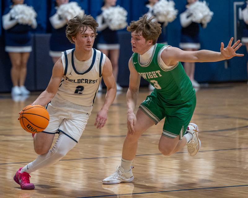 Braden Hahn (2) of Fieldcrest dribbles ball past Collin Bachand (3) of Dwight on Monday, December 15, 2025 at Fieldcrest High School in Minonk.