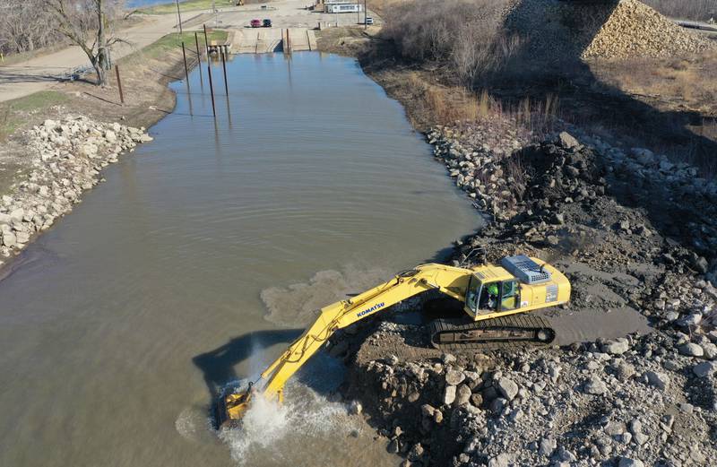 An excavator dredges the harbor at Barto Landing on Wednesday, March 26, 2025 in Spring Valley. Earlier this month, the Spring Valley City Council approved a proposal for  $150,000 to dredge Barto Landing. River Docks Inc. of Peru was awarded the job. The city continues to pursue additional grant money to be reimbursed for the Barto Landing revitalization efforts.