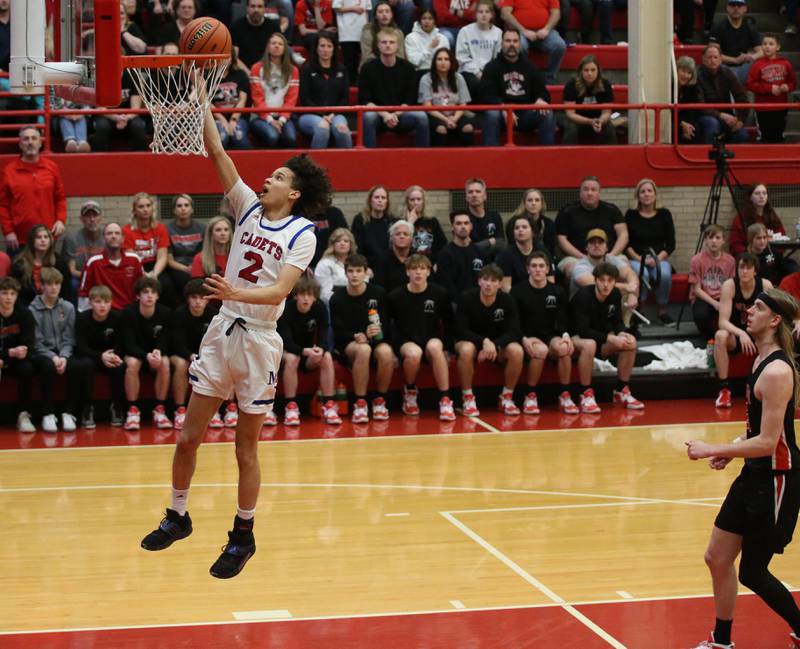 Marmion's Jabe Haith runs in all alone to score on a layup past Metamora's Ethan Kizer during the Class 3A Super-Sectional on Monday, March 6, 2023 at Ottawa High School.