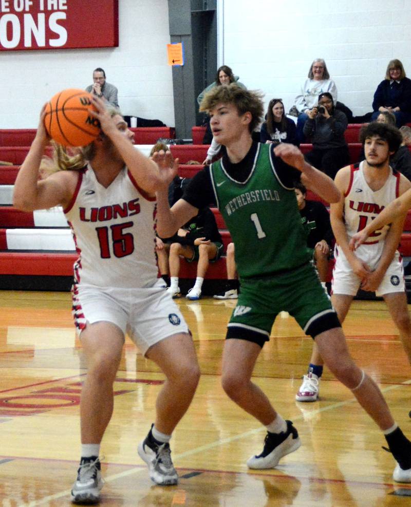 LaMoille's Wyatt File posts up against Wethersfield in Tuesday's game in the LaMoille Holiday Classic.