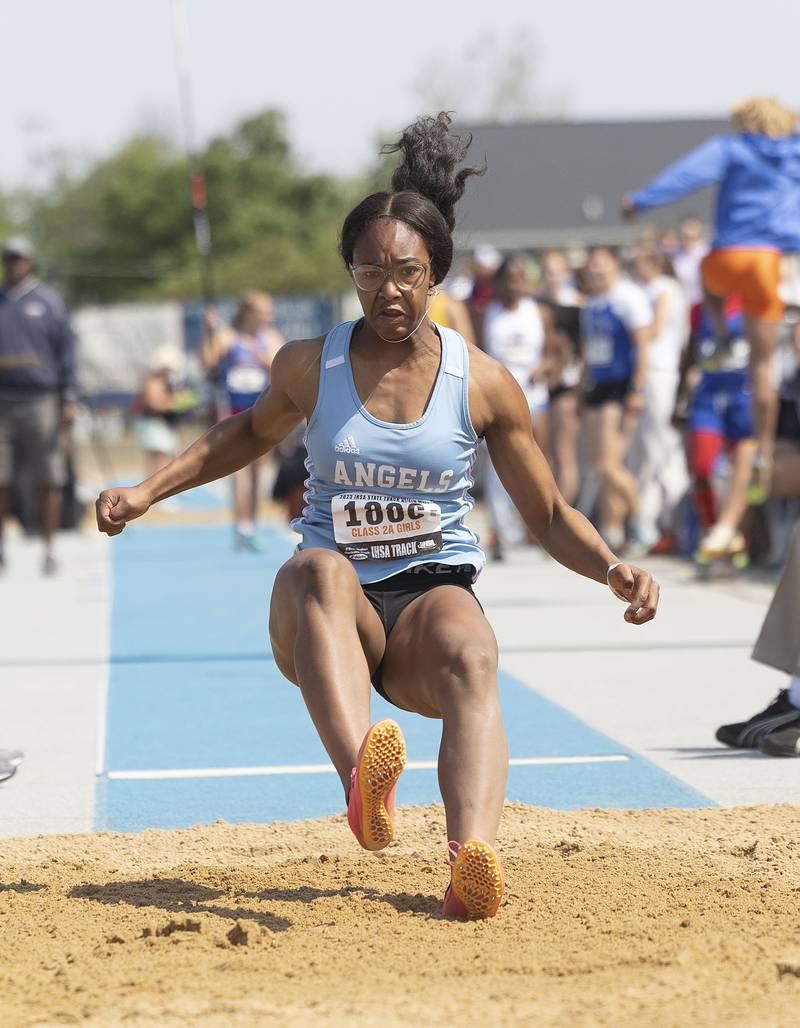 Joliet Catholic’s Symone Holman lands her 2A long jump Saturday, May 20, 2023 during the IHSA state track and field finals at Eastern Illinois University in Charleston.
