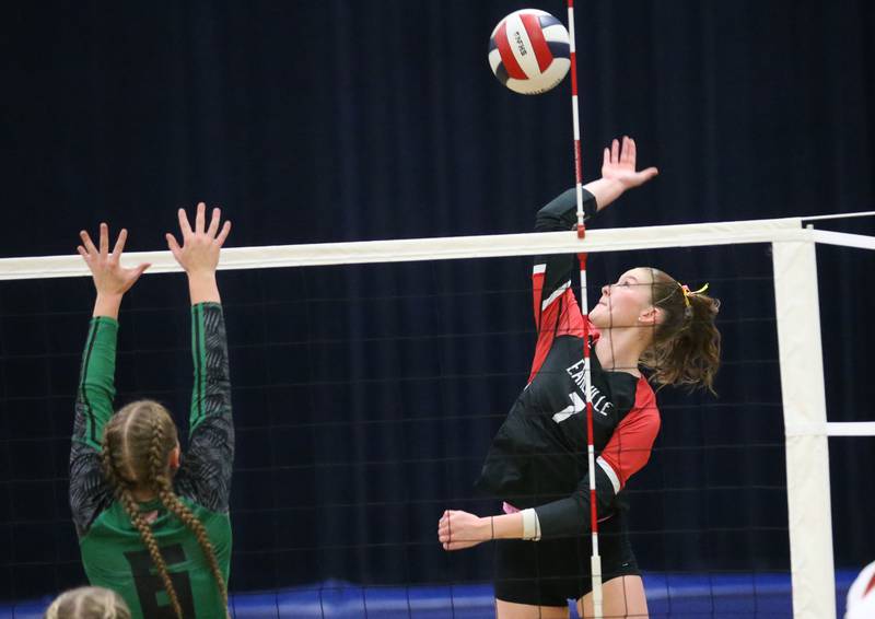 Earlville's Bailey Miller spikes the ball past Leland's Macey Kinney during the Class 1A Regional semifinals on Monday, Oct. 27, 2025 at Somonauk High School.
