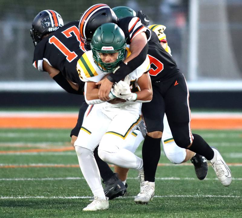 Crystal Lake South’s Michael Silvius is brought down against McHenry in varsity boys football at McCracken Field on the campus of McHenry High School in McHenry on Friday, Sept. 5, 2025.