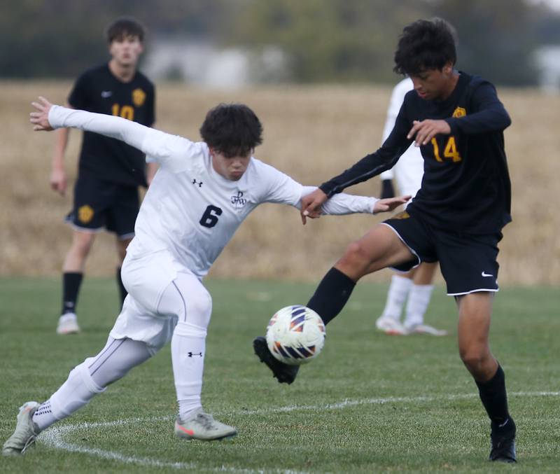 Richmond-Burton's Johann Boentges (right) kicks the ball away from F.W. Parker's Brandon Wolin during an IHSA Class 1A Johnsburg Sectional semifinal match on Oct. 28, 2025, at Johnsburg High School.