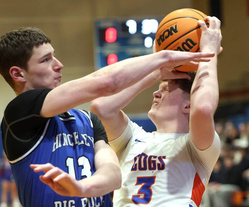 Genoa-Kingston's Jack Peterson is fouled by Hinckley-Big Rock's Jacob Orin as he goes to the basket Tuesday, Jan. 6, 2026, during their game at Genoa-Kingston High School.