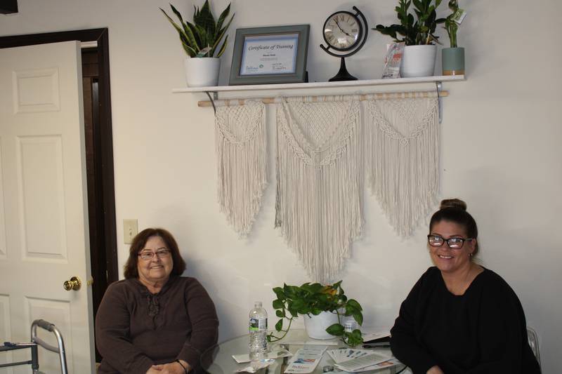 Customer Sue Burton meets with Mandy Rae Sisak of Mandy Rae's Eyebrow Studio in Rock Falls.
