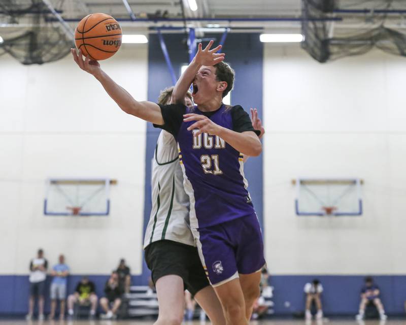 Downers Grove North's Jack Romsey (21) puts up a contested shot in their Riverside-Brookfield Shootout basketball game.  June 20, 2025 in Riverside.