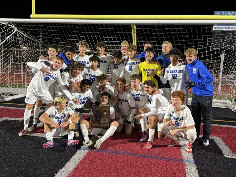 St. Charles North celebrates winning the Class 3A Huntley Regional championship on Friday, Oct. 24 at Huntley High School.