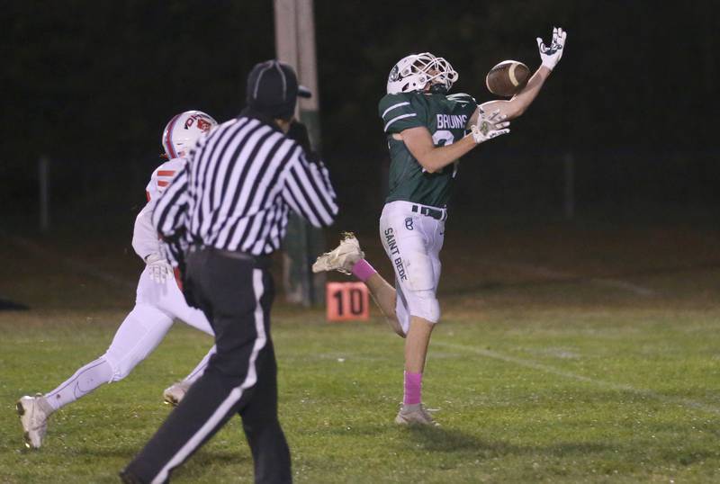 St. Bede's Phillip Gray manages to make a catch to score a touchdown over Ottawa on Friday, Oct. 25, 2024 at St. Bede Academy.