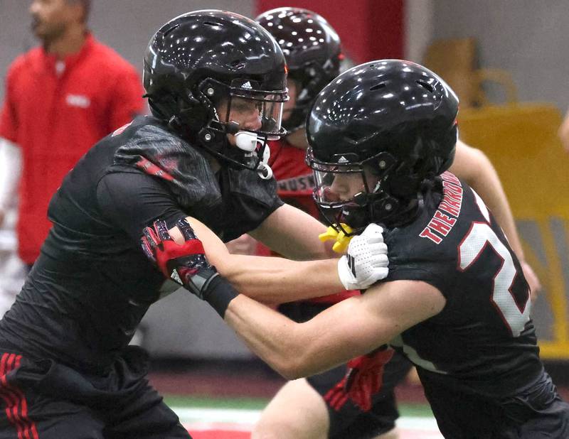 Northern Illinois’ Gary Givens (left) participates in a drill Wednesday, July 30, 2025, at the teams first practice of the season in the Chessick Practice Center at NIU in DeKalb.