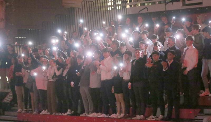 L-P super fans shine the light on their phones as the Cavaliers are introduced on Friday, Jan. 5, 2023 at Sellett Gymnasium