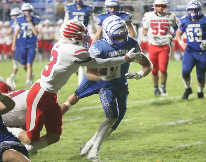Princeton's Casey Etheridge gets by Oregon's Ethan Mowry during the first round of the Class 3A playoffs on Friday, Nov. 1, 2024 at Princeton High School.