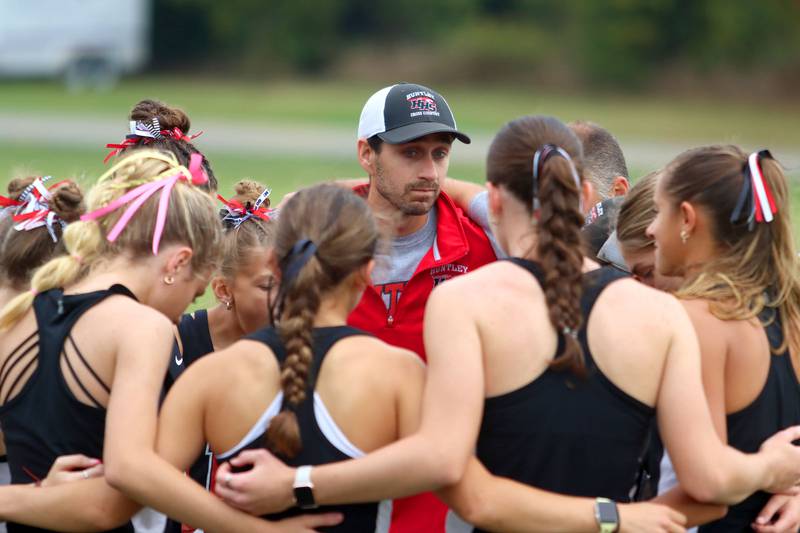 Huntley girls runners gather before the Fox Valley Conference Cross Country Meet at McHenry County College in Crystal Lake on Saturday, October. 18, 2025.