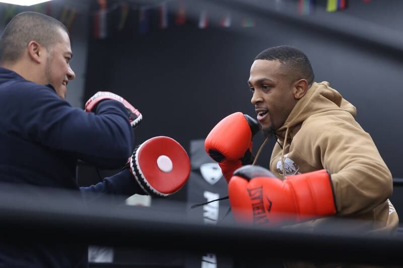 Co-owner Oscar Hernandez does a sparing demonstration with professional boxer Chris Gooch at the ribbon cutting ceremony for his training facility Spartan Boxing on Wednesday, Nov. 8, 2023 in Lockport.