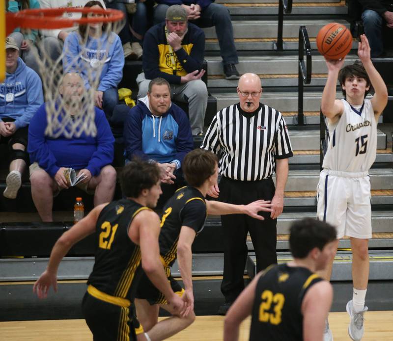 Marquette's Alec Novotney shoots a jump shot over Putnam County defenders during the Tri-County Conference Tournament on Tuesday, Jan. 23, 2024 at Putnam County High School.