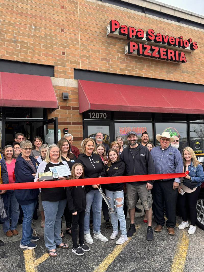 The Huntley Area Chamber of Commerce celebrates a ribbon cutting at Papa Saverio's April 11, 2024.