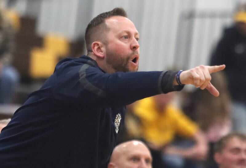 Cary-Grove’s Head Coach Adam McCloud leads the Trojans against Jacobs during Hinkle Holiday Classic varsity boys basketball tournament action on Thursday, Dec. 26, 2024 at Jacobs High School in Algonquin.