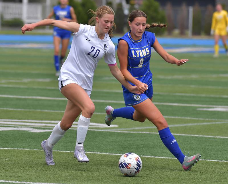 Downers Grove North’s Grace Gagnon (20) and Lyons Township’s Carolina Capizzi race for the ball during their Class 3A Lyons Regional final on May 23, 2026 at Lyons Township High School in LaGrange.