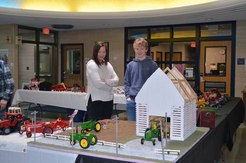 Dana Conkrite, of Lanark, talks to nephew Jace Urish, of Milledgeville, while looking at models during the Polo Lions Club’s 38th Farm Toy Show. The event was held at Polo Community High School on March 4.