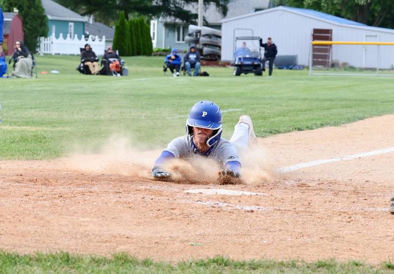 Princeton's Stihl Brokaw slides into home in the fifth inning to make the score 3-2 in Monday's regional semifinal game against Kewanee at Prather Field.