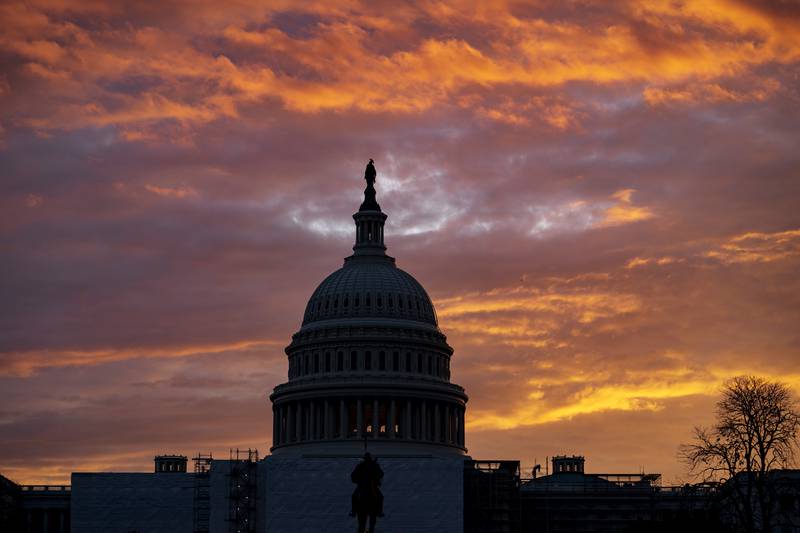 Hues of red and blue color the dawn at the Capitol in Washington, Monday, Nov. 7, 2022. Control of Congress and of President Joe Biden's agenda on Capitol Hill are at stake this Election Day. Energized Republicans are working to claw back power in the House and Senate and end the Democratic Party's hold on Washington. (AP Photo/J. Scott Applewhite)