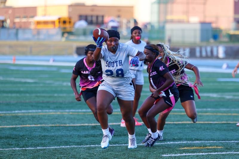 Plainfield South's Cyncere Falconer attempts to gain a first down as Kankakee's Essence Bell, right, gets the stop during the Kays' 40-26 victory over Plainfield South on Monday, Oct. 6, 2025.
