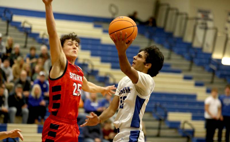 Geneva’s Anish Buddaraju tries to shoot the ball past South Elgin’s Ilija Babic during a game on Monday, Nov. 25, 2024 in Geneva.