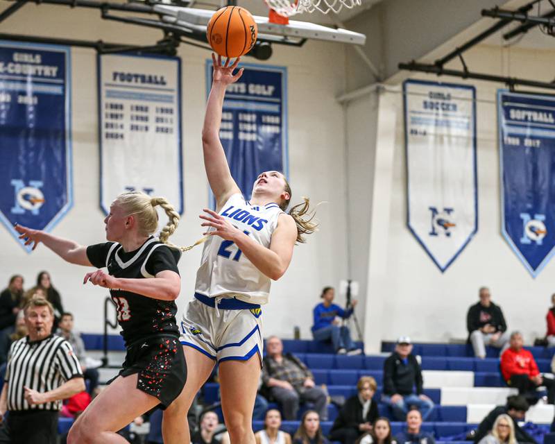 Lyon's Gwen Smith (21) puts in a layup during their Coach Kipp's Hoopfest basketball game between Lyons at St Charles East. Jan 18, 2025 in La Grange.