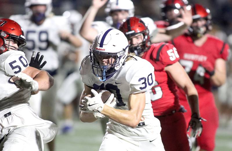 Cary-Grove’s Landon Moore cruises for the end zone on a touchdown run in varsity football at Huntley High School in Huntley on Friday, Sept. 19, 2025.