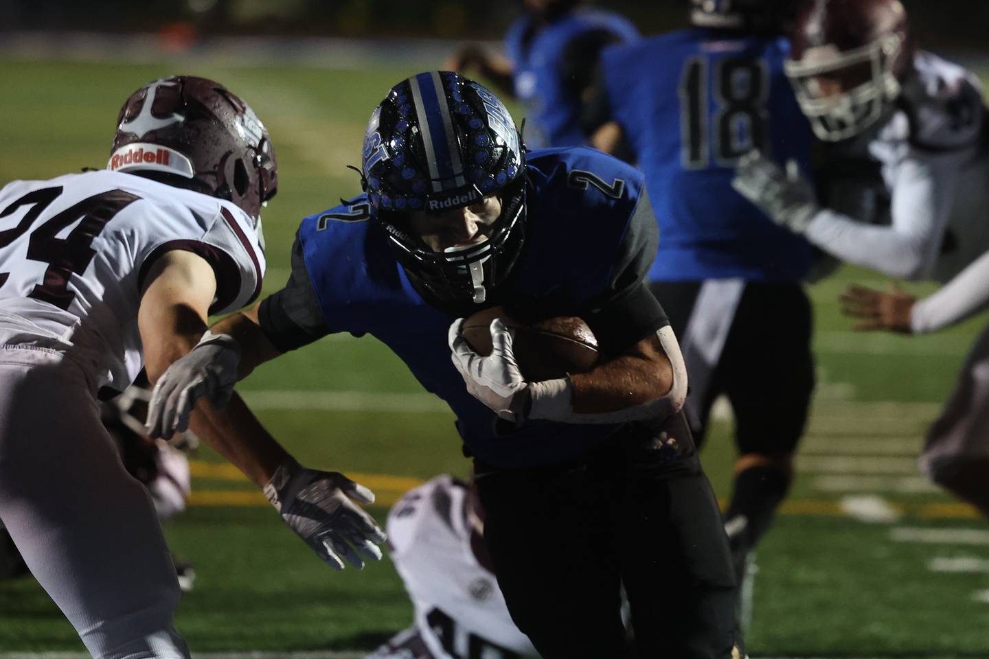 Lincoln-Way East’s James Kwiecinski works his way into the end zone against Lockport Friday night.