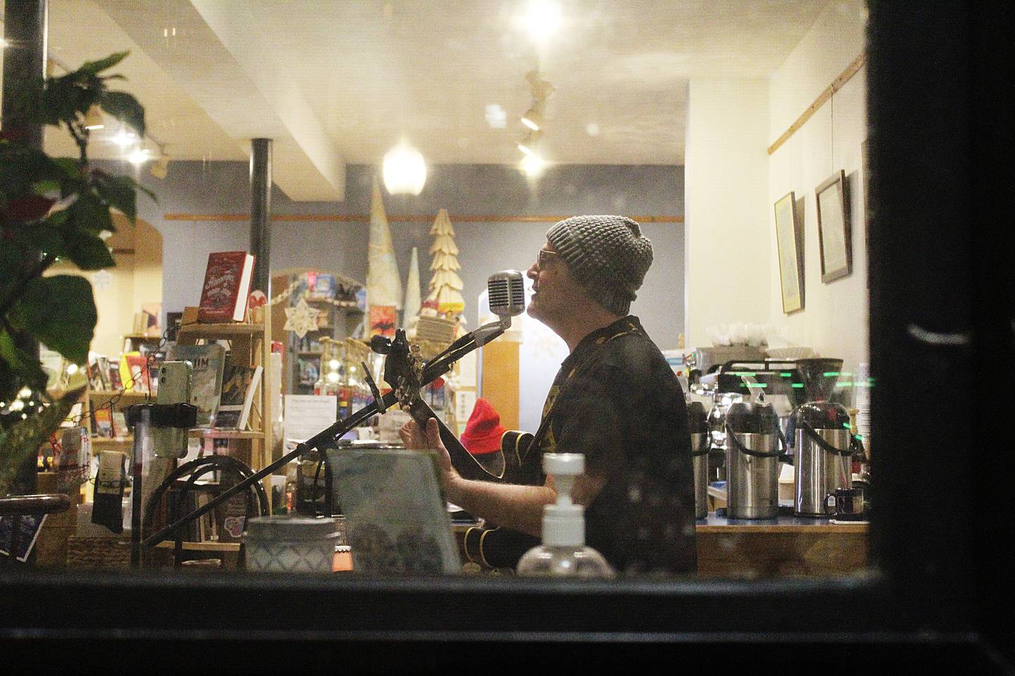 Todd Lorenc performs a concert Feb. 15, 2025 at Books on First in downtown Dixon. Whether it’s at music venues with crowds, or in front of shoppers at stores, Lorenc hopes his music makes people come home with something to think about, he said.