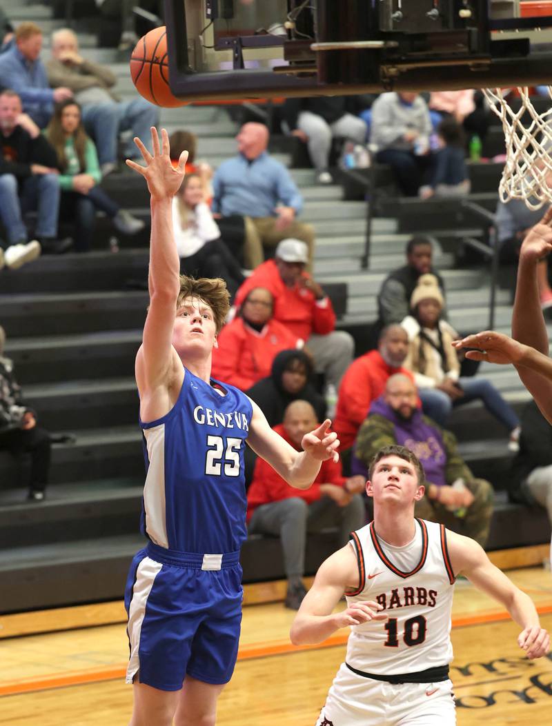 Geneva’s Hudson Kirby scores in front of DeKalb’s Eric Rosenow Thursday Dec. 28, 2023, during their second round game in the 96th Chuck Dayton Classic boys basketball tournament at DeKalb High School.