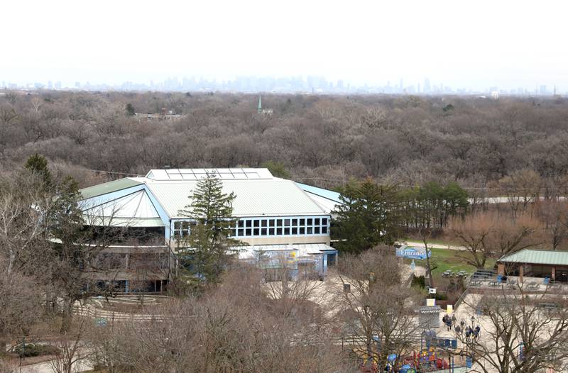 An overhead view of from the Brookfield Zoo’s 110-foot Ferris wheel with the Chicago skyline in the distance. The Ferris wheel, in honor of the zoo’s 90th anniversary, opened on Friday, March 15, 2024. The Ferris wheel offers guests unique bird’s-eye views of the park’s gardens, animal habitats and Chicago skyline.