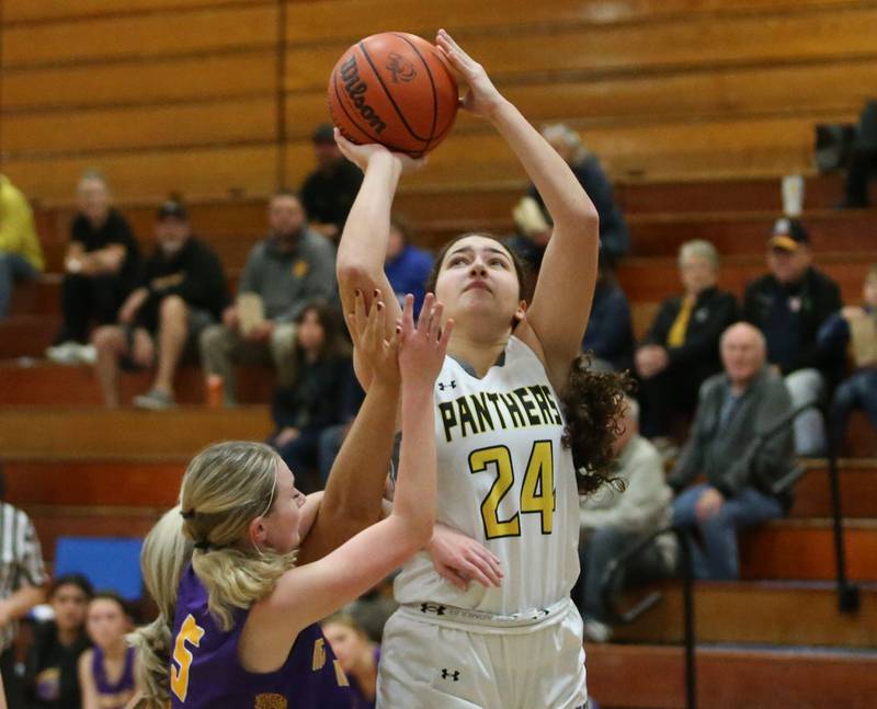 Putnam County's Maggie Richetta shoots a jump shot over Mendota's Bria Fery during the Princeton High School Lady Tigers Holiday Tournament on Tuesday, Nov. 14, 2023 in Prouty Gym.