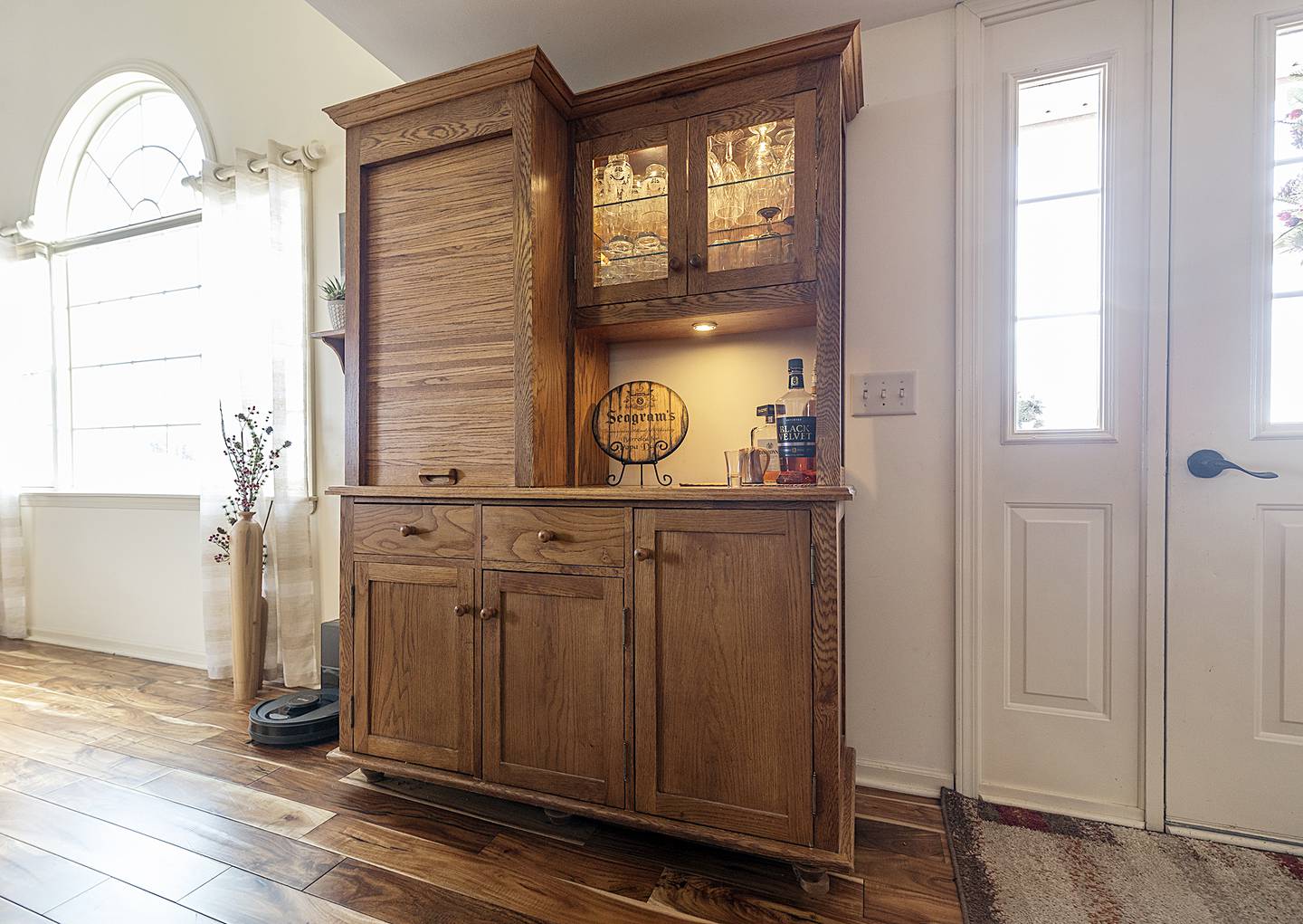 Not all of Dave Smith's wood creations leave the Mount Carroll home he shares with his wife Jan: They make his living room look appealing. He built a bar that sits prominently in their living room (shown here), he turned a piece of cherry burl into a lamp stand, and made a bowl he made for decor sits on their dining room table.