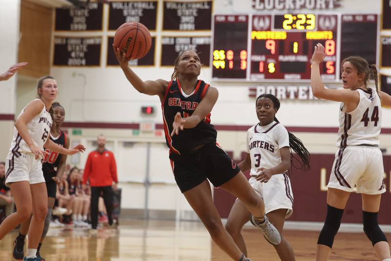 Lincoln-Way Central’s Azyah Newson-Cole lays in a shot against Lockport.