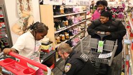 Nearly 100 DeKalb area children shop for holiday gifts alongside police 