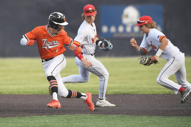 Wheaton Warrenville South’s Chris Myers gets caught in a rundown and tagged out by Batavia’s Matthew Reksnis in the first inning in a Class 4A sectional semifinal game in Elgin on Wednesday, May 31, 2023.