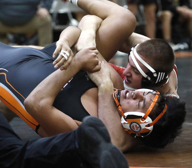 Huntley’s Wyatt Theobald controls  McHenry’s Ariel Montes during the 190-pound match of a Fox Valley Conference boys wrestling match Thursday, Jan. 11, 2024, at McHenry High School.