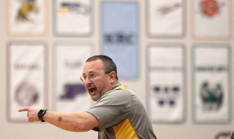 Harvard’s Head Coach Brian Heidtke guides the Hornets in varsity boys basketball at Johnsburg Saturday.