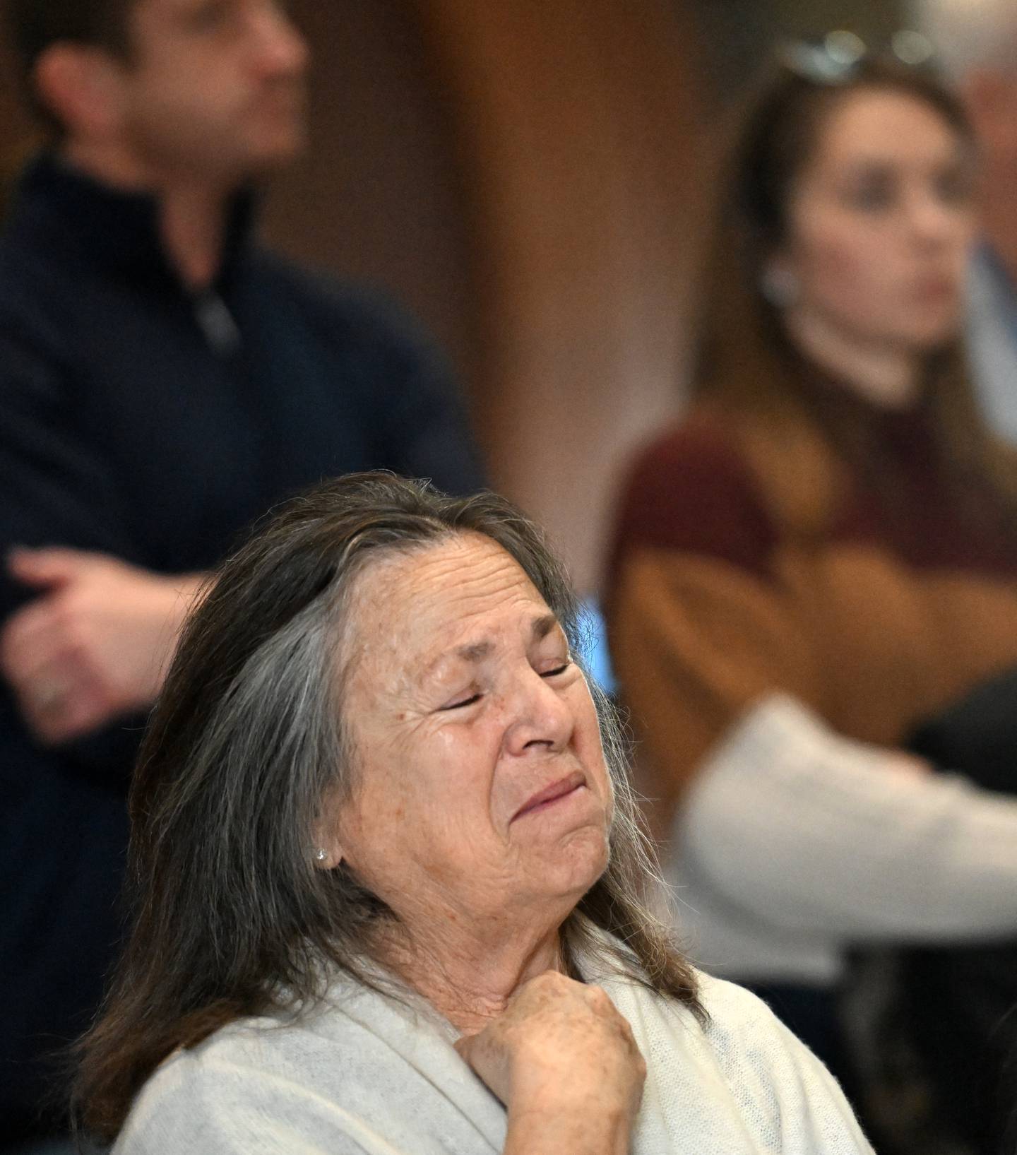 Ellen Ljung of Geneva is moved to tears during CASA Kane Countys Hands Around the Courthouse event Thursday in Geneva. Ljung has volunteered as a child advocate for the group for three years.