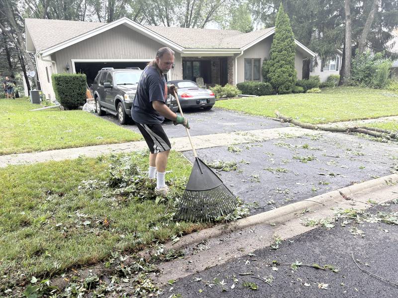 Milos Gercic of Cary cleans up storm damage Aug. 17, 2025.