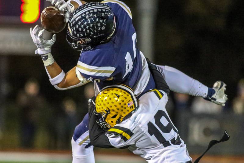 IC Catholic Prep's Dominik Hulak (40) comes down with a catch during Class 4A third round playoff football game between St Laurence at IC Catholic Prep.  Nov 11, 2023.