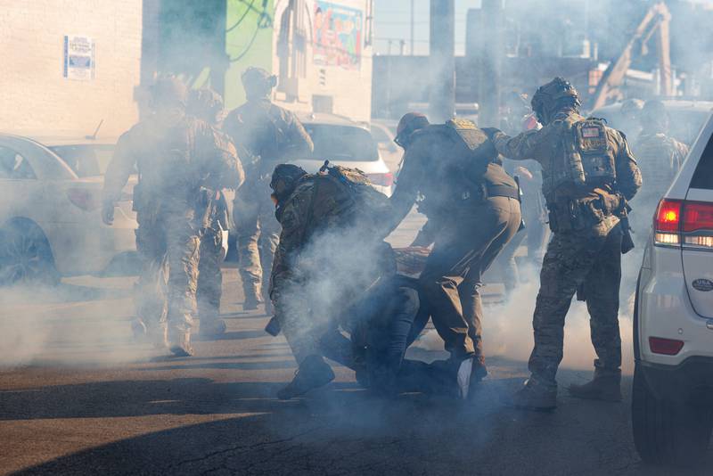 FILE - Federal immigration enforcement agents detain a protester in the Little Village neighborhood of Chicago on Oct. 23, 2025. (Anthony Vazquez/Chicago Sun-Times via AP, File)