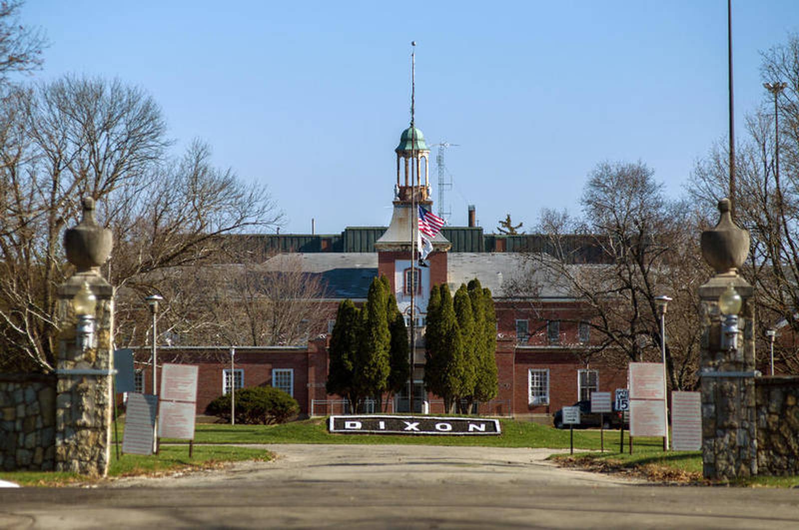 One inmate death, virus cases surging at Dixon Correctional Center