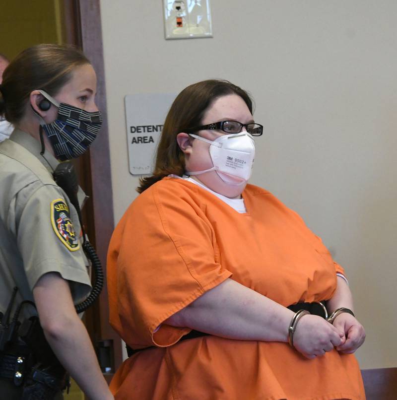 In this May 2021 file photo, Sarah Safranek is escorted into an Ogle County Courtroom. She is charged with five counts of first-degree murder and one count of aggravated battery in the death of her son, Nathaniel Burton, 7.
