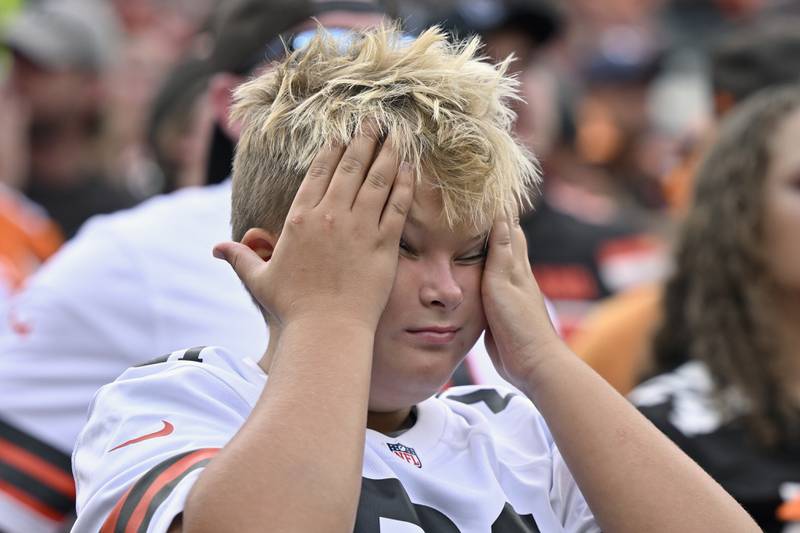 A Cleveland Browns fan reacts late in the fourth quarter of an NFL football game between the Browns and the New York Jets, Sunday, Sept. 18, 2022, in Cleveland. The Jets won 31-30. (AP Photo/David Richard)