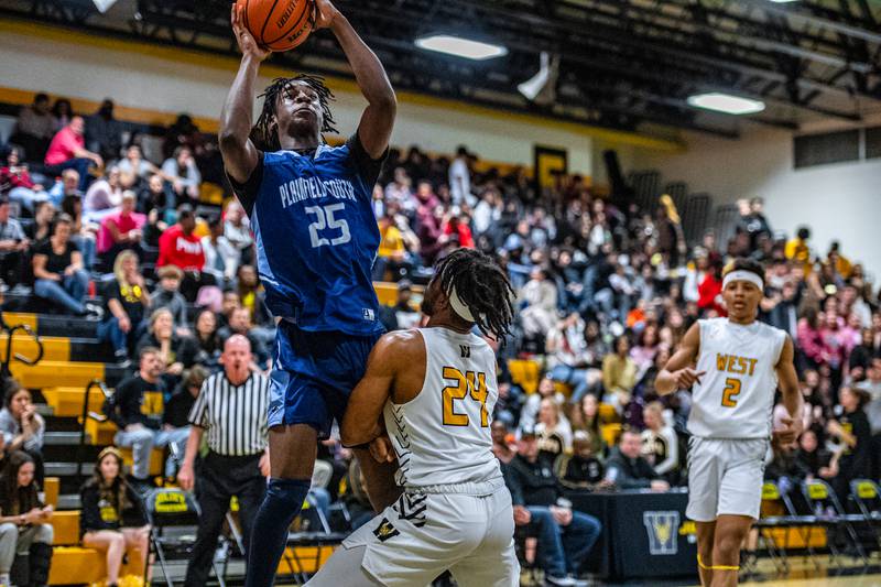 Plainfield South's Jeremiah LeSure puts up a shot during a game against Joliet West Tuesday Feb. 14, 2023 at Joliet West  High School
